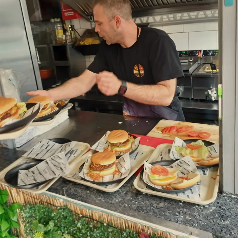 Fresh over the counter: Mike plates the burgers